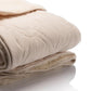 Organic cotton, GOTS certified from one side of the blanket quilted with woolen padding.