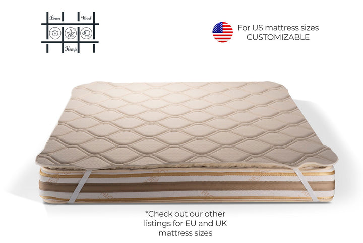 Hemp and merino wool mattress topper with straps on a white background, featuring customizable text for US mattress sizes. Handcrafted by Woolland