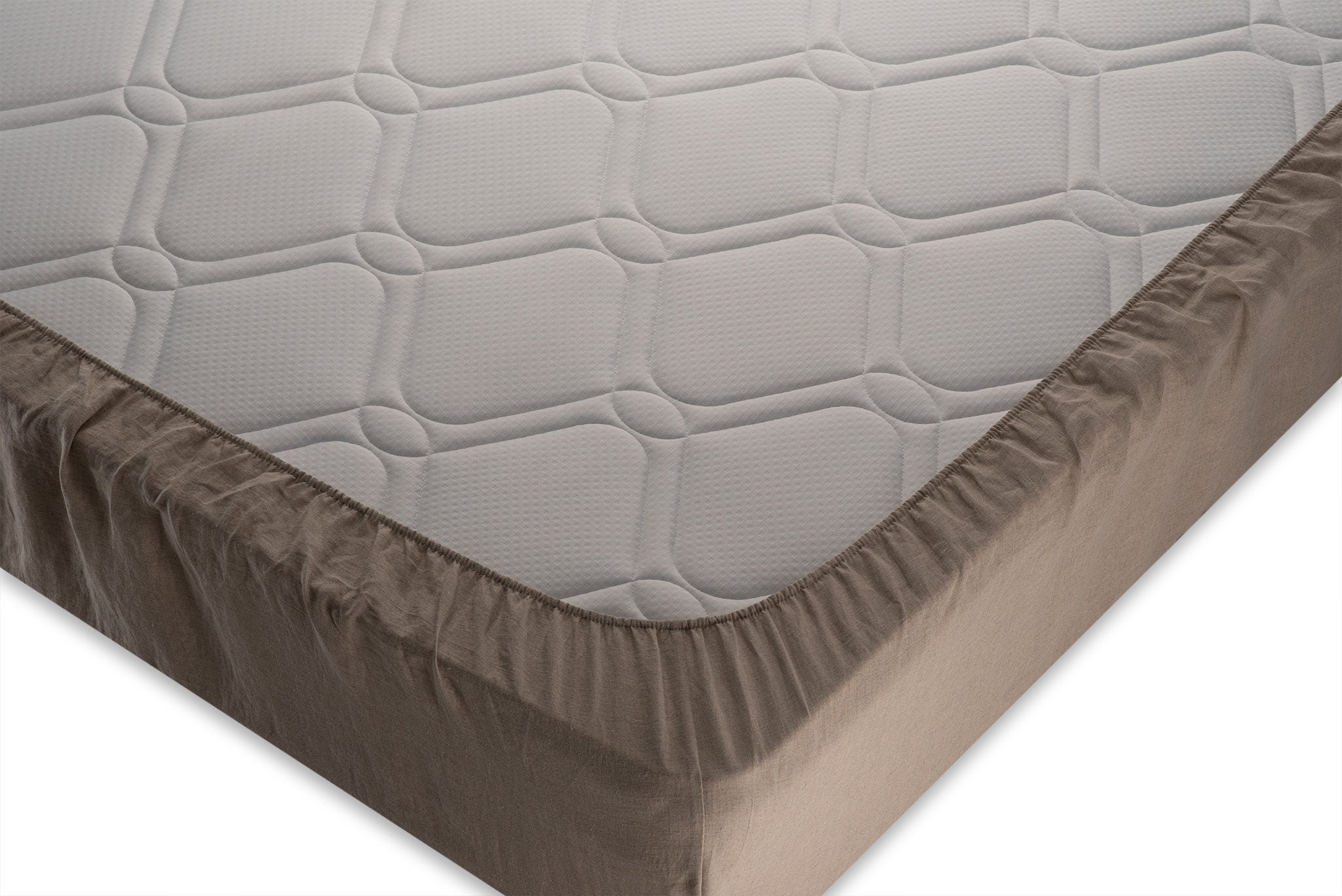 Corner close up photo of linen fitted sheet made by the Woolland from natural linen colored fabric.