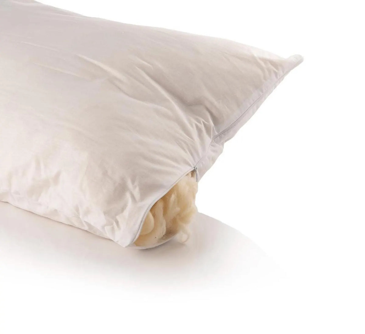 A closeup on natural wool pillow on a white background