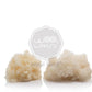 Two sheepskin puffs with a Woolland brand logo on a white background