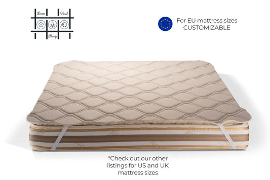 Hemp and organic cotton mattress topper with straps, featuring customizable text for EU mattress sizes by Woolland 