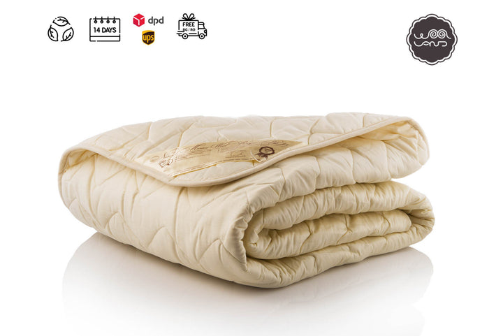 Folded wool filled cotton sateen quilt on a white background with Woolland logos and icons above it