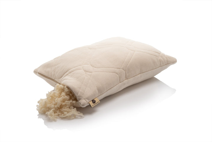 2 sided Woolland natural pillow with sheep wool stuffing on a white background