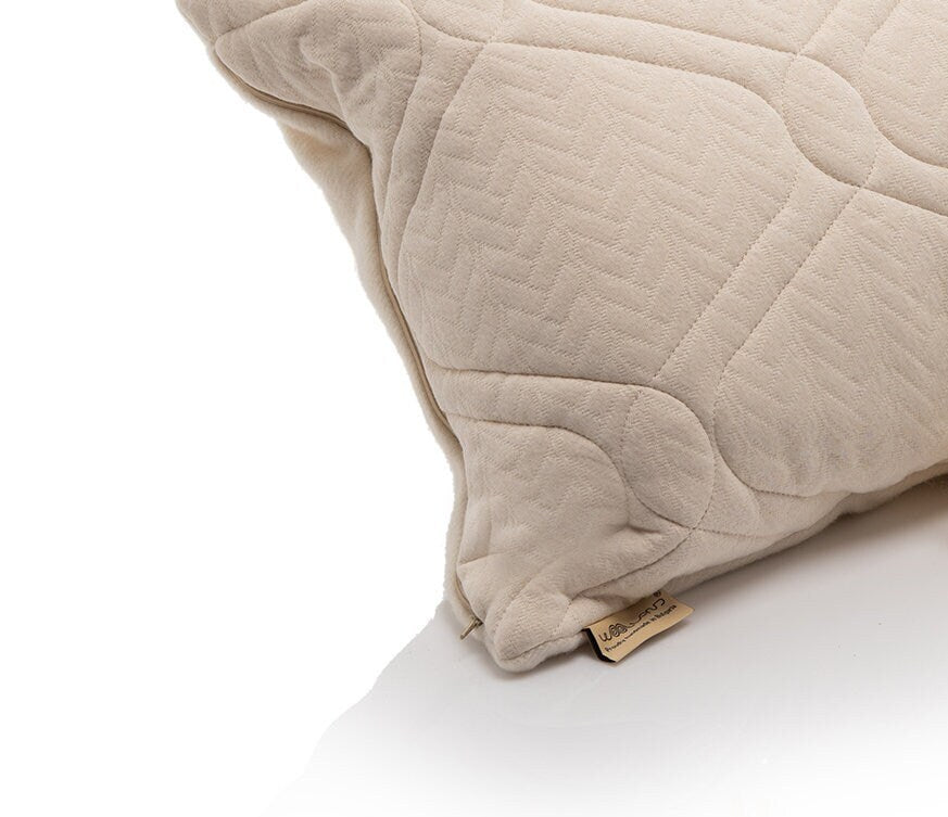 Hemo and organic cotton quilted pillow with a Woolland brand tag on a white background