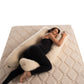 lady laying and snuggling natural merino wool pregnancy pillow handmade by the Woolland
