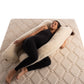 Pregnant lady laying on u-shaped merino wool maternity pillow by Woolland