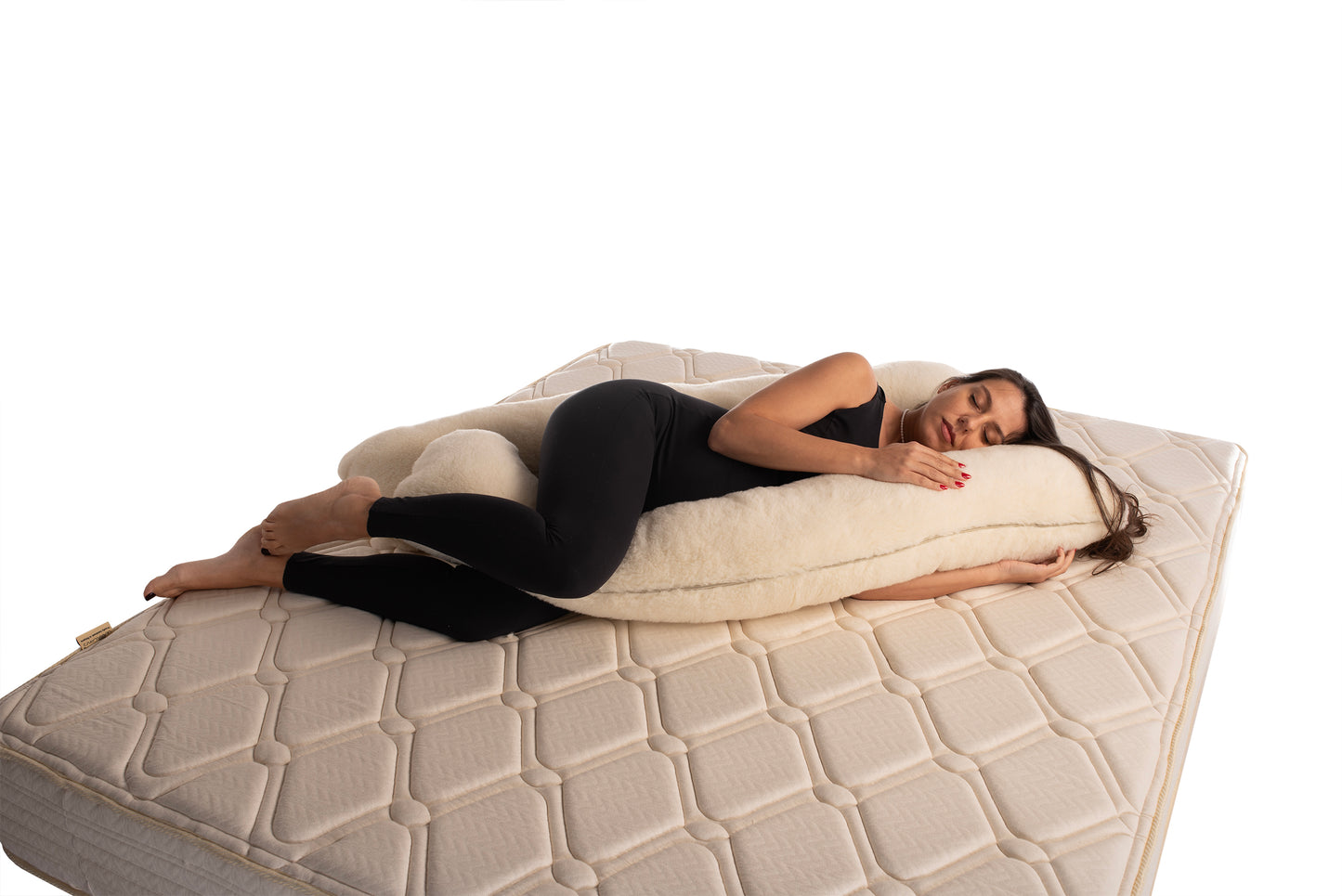 A frontal look of pregnant beautiful lady with merin wool full body pregnancy pillow by woolland