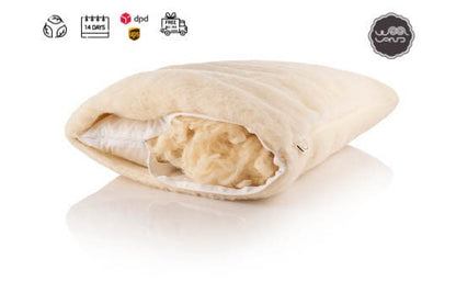 A beige organic wool sleeping pillow with a visible cotton fabric inner case, displayed against a white background with icons indicating its features such as being hypoallergenic and having a zip fastener.