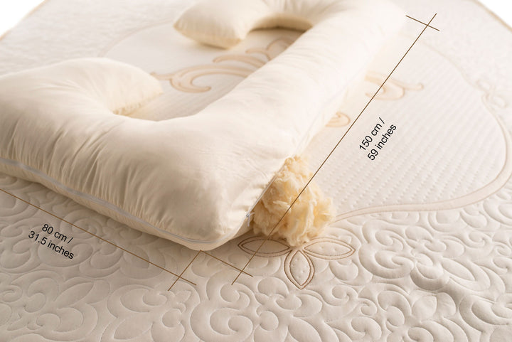 C-shaped pregnancy pillow with raw wool filling and cotton sateen cover with width 80 cm and length 150 cm made by Woolland