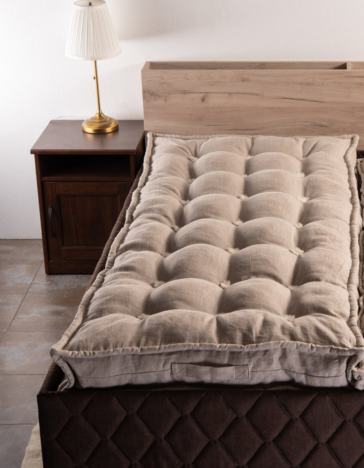 Linen and wool handmade mattress on a bed