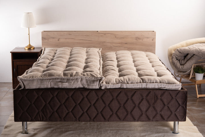 Natural linen cover and Bulgarian wool filling handmade mattresses on a bed