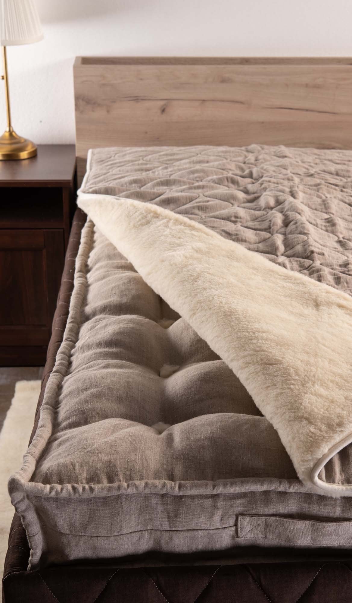 Merino wool and linen blanket on top of natural handmade mattress 
