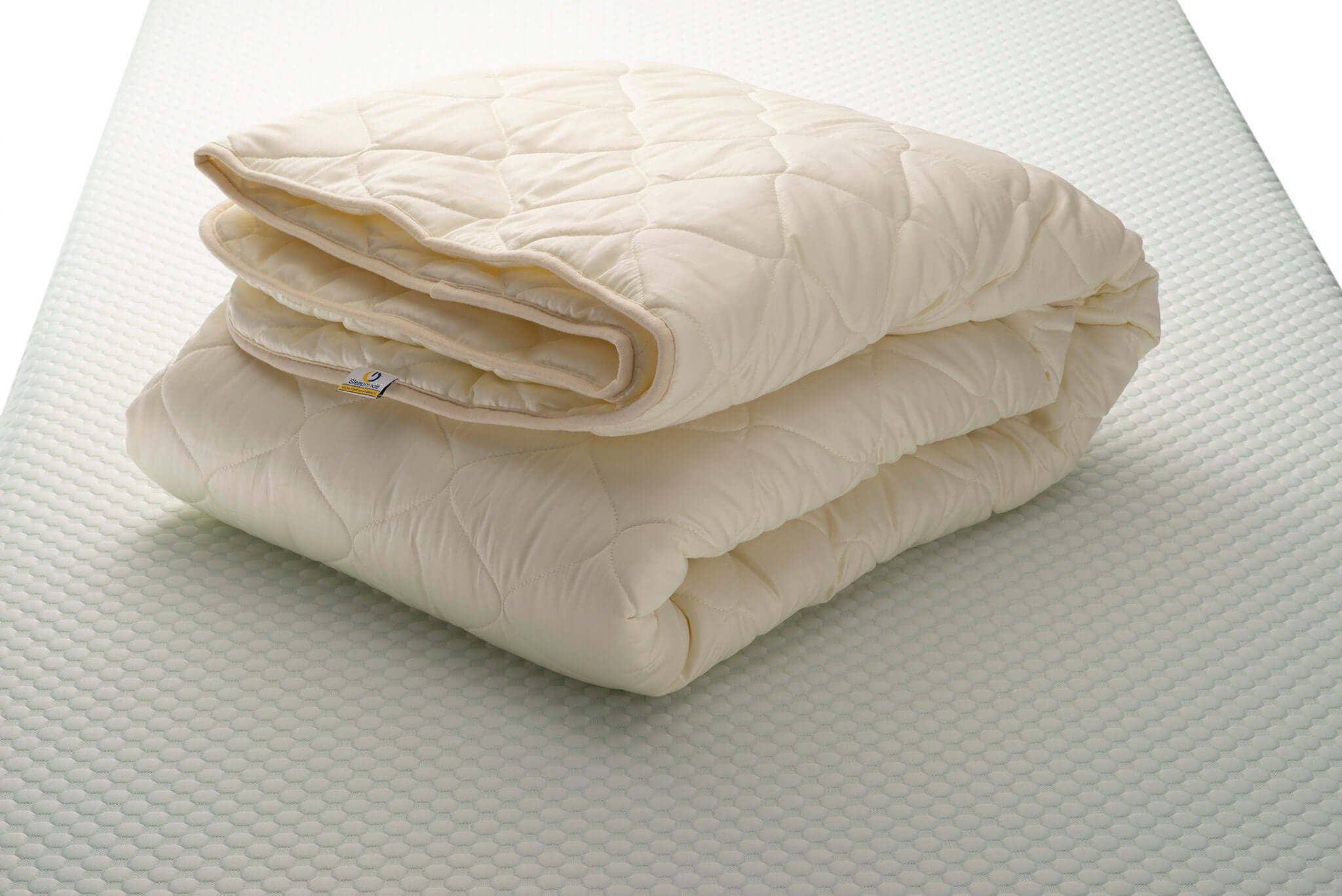Folded Woolland cotton sateen and merino wool quilt